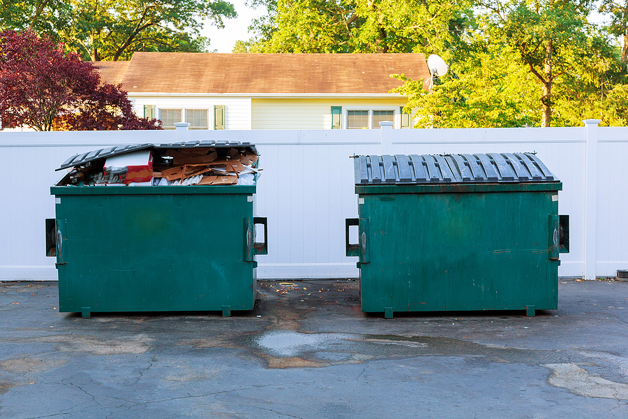 Dumpsters being full with garbage container Over flowing